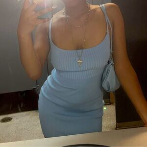 4 Dresses and 1 jumpsuit bundle all a size medium and mildly worn.